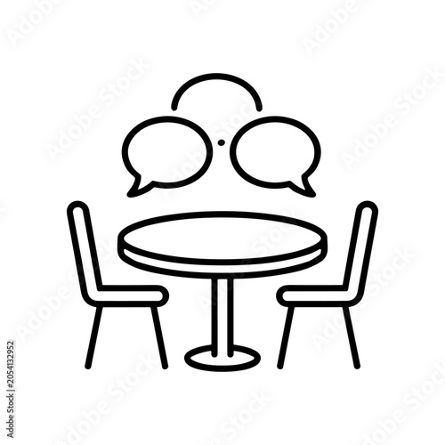 Photos People sitting at a table talking.