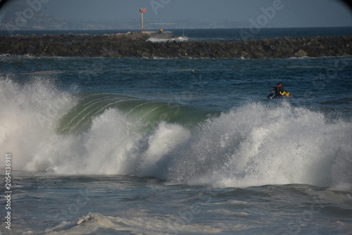 Giant swell barrels breaking at the wedge