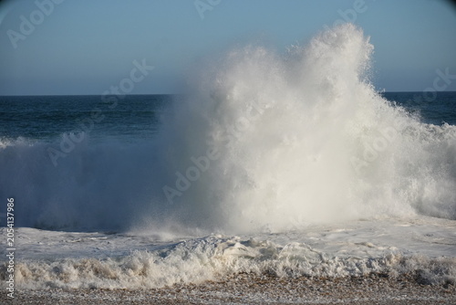 Wave exploding with white wash at the wedge