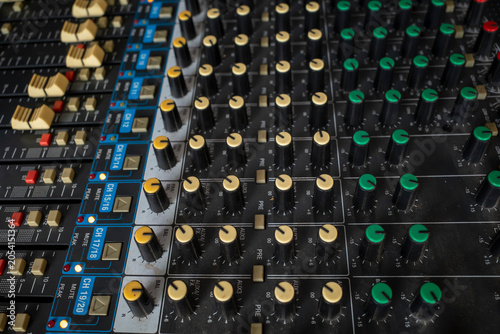Fotografia Colorful knops of electronic sound mixer, shallow focus