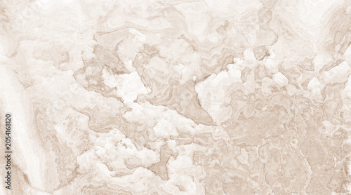 Photos A close-up of a marble surface with swirling patterns in beige and white tones,