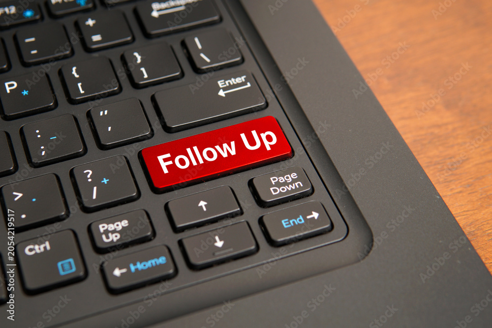 Fototapeta premium Follow up concept on computer keyboard with highlighted red key, representing customer engagement, sales communication, lead management, and business process continuation.