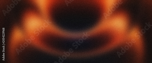 Abstract background with warm orange and dark brown glowing light flares on grainy surface creating dramatic intense atmospheric effect for creative graphic design.