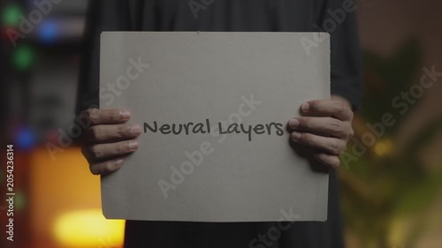 Neural Layers Written on Banner – Man Holding Placard