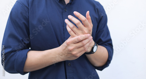 Bild auf Leinwand close up adult man massage on fingers to relief pain from hard working for treat