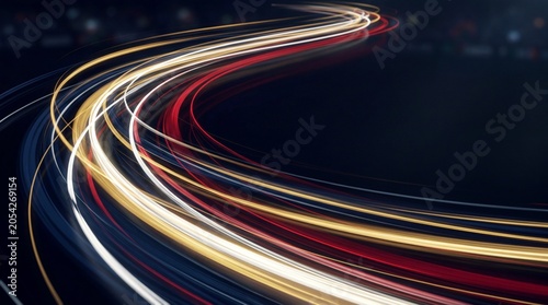 Abstract long exposure light trails of night traffic on a curved highway road