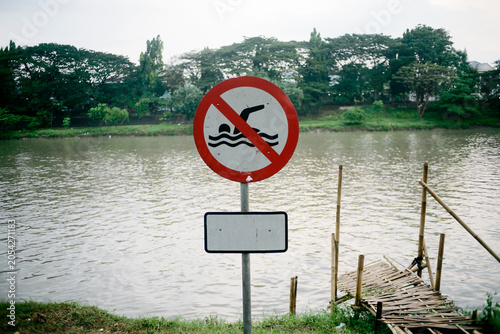 close up of no swimming sign on the river