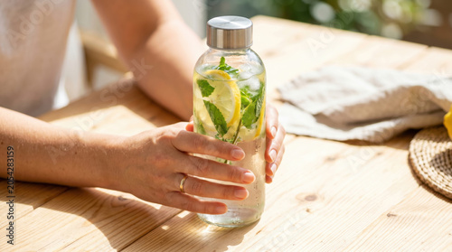 Refreshing Lemon Infused Water in Hand