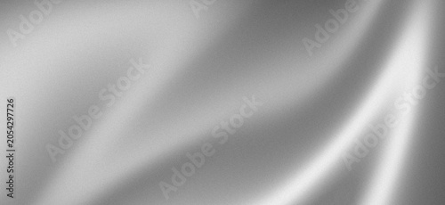 Elegant abstract silver silk fabric background with soft smooth, flowing waves