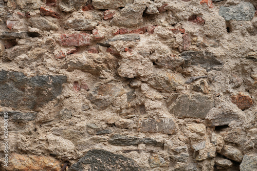 Obraz na płótnie Grey stone and brick wall texture with rough surface ideal for backgrounds and a