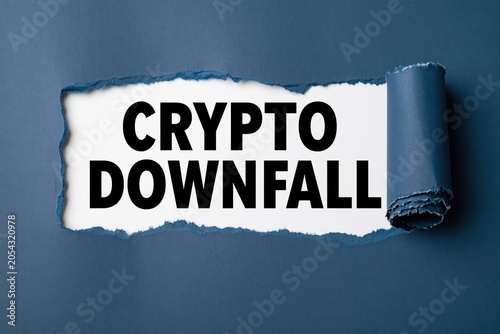 crypto downfall text revealed under torn dark blue paper
