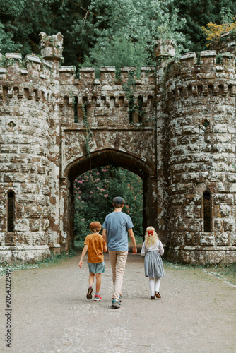 Family Walking Through Historic Ballysaggartmore Castle in County Waterford, Ireland