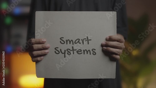 Smart Systems Written on Banner – Man Holding Placard