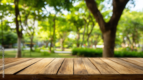 A rustic wooden table stands in the foreground, with a lush, blurred green park providing a serene backdrop.