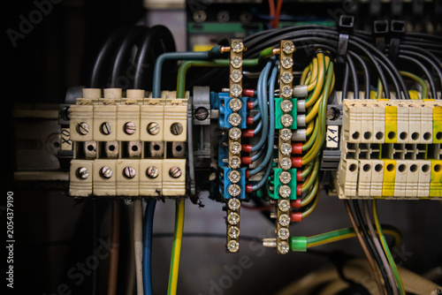 Obraz na płótnie Industrial control panel wiring with terminal blocks and copper busbars