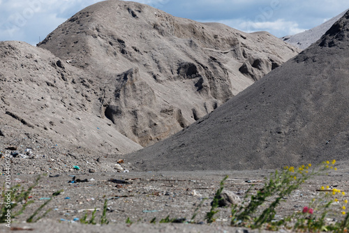 Industrial Waste Ash and Slag Landfill Landscape Under Blue Sky