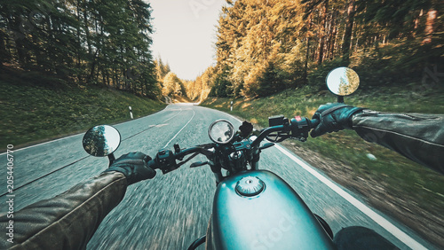 Bild auf Leinwand Riding classic retro motorcycle  naked bike on land road curves on sunny summer