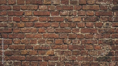 Fotografie Weathered Brick Wall Texture Closeup Image.