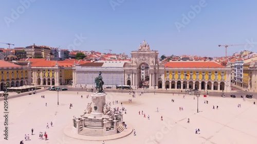 Lisbon City on Sunny Day. Commerce Plaza, Equestrian Statue, Tourists and Rua Augusta Arch. Portugal. Aerial Drone Shot. Orbiting