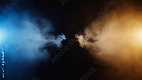 Blue and orange smoke colliding in dark background