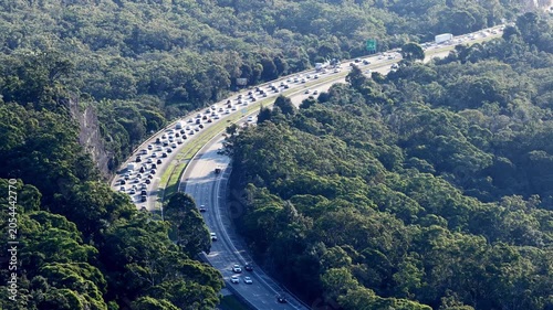 Close up view of long Motorway M1 multi-lane highway slow heavy holiday traffic jam.