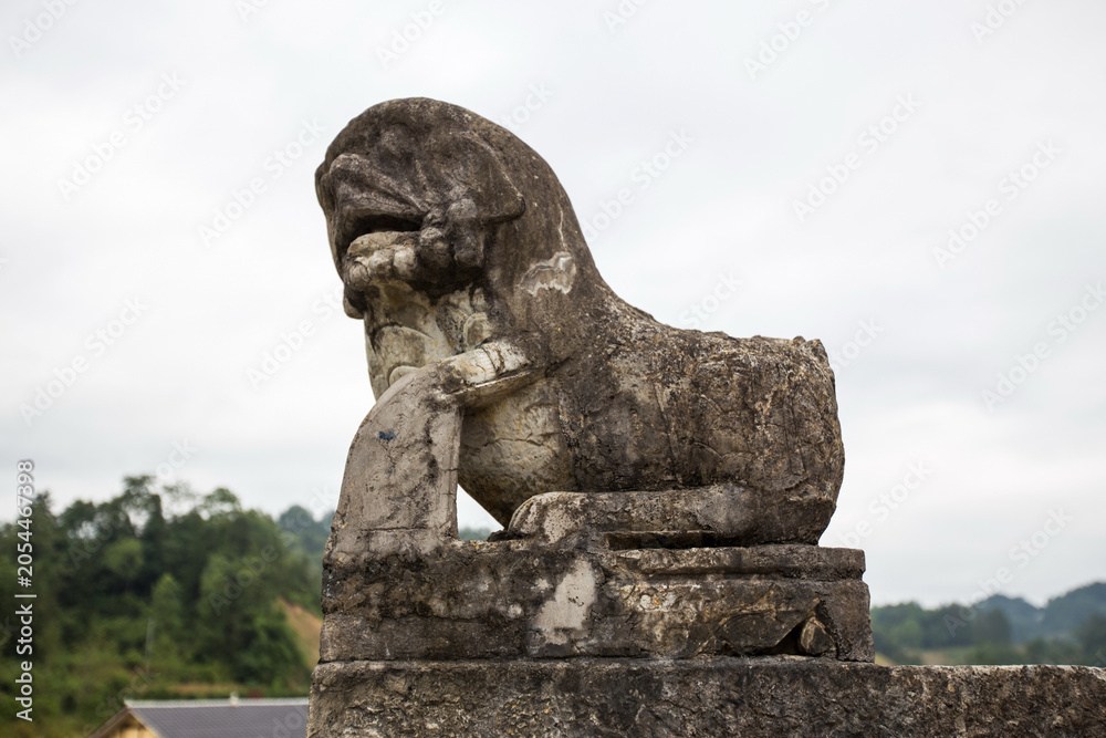 Fototapeta premium Ancient Stone Lion Guardian Statue at Gongguanqiao, Zunyi China