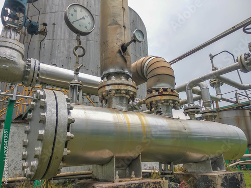 Quadro su tela Industrial heat exchanger pipe system with steel flanges at chemical factory