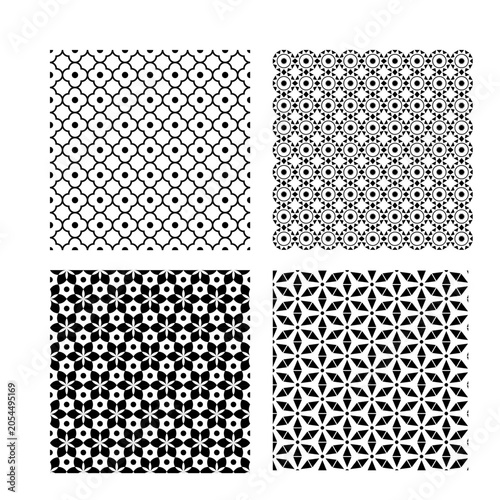 Set of Four Seamless Monochrome Geometric Ornamental Patterns with Intricate Decorative Shapes and Radial Motifs