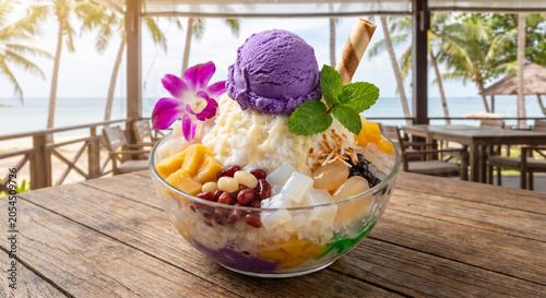 Philipine halo-halo dessert with fruits, sweetened beans, tropical fruits, mint and sweet toppings