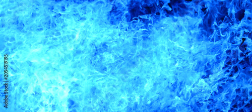 Bilde på lerret Blue flames blazing against a black background