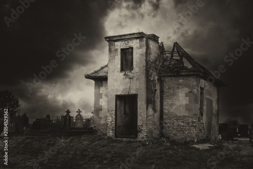 Fotografie Dark creepy cemetery on a cloudy autumn day