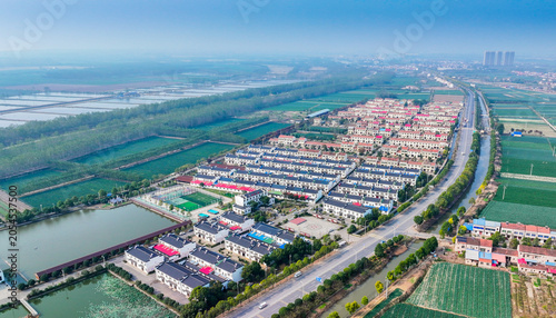 Schilderij op canvas Aerial View of Siyi Village New Residential Development and Rural Landscape