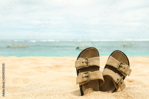 Cuadro en lienzo Footwear resting in soft sand near the sea in Bali