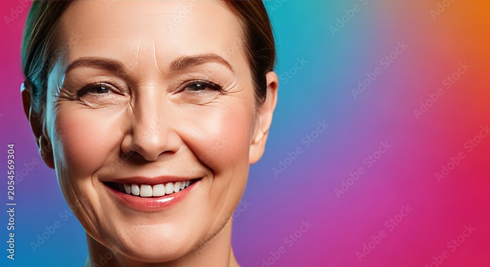 Naklejka premium Radiant mature face with warm expressive eyes and rosy cheeks, showcasing timeless beauty and elegant aging through a gentle, joyful smile, aging, wrinkles, happiness