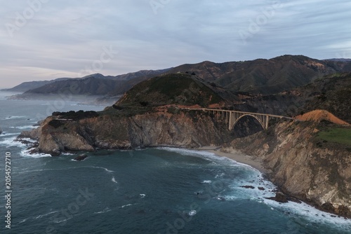 Aerial view of Bixby Creek Bridge near Monterey on the Big Sur coast, California, at sunset. g.