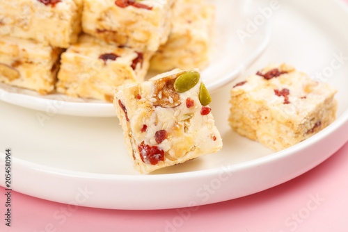 Schilderij op canvas Handmade Praline Cranberry Shortbread Bars with Pistachio Garnish