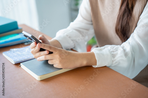 Bild auf Leinwand Student asian woman lying use smart phone in dorm room college mobile addict spending time checking news technology e-commerce