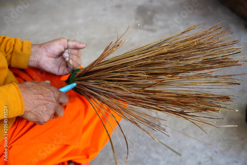 Traditional Thai handcrafted brooms made from coconut trees.
