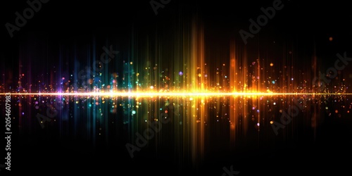 Abstract spectrum of colorful light beams and particles on black