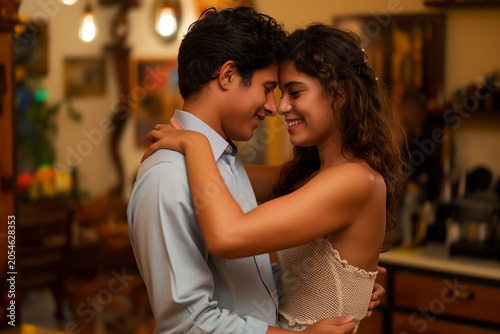 A man and a woman are hugging each other in a kitchen
