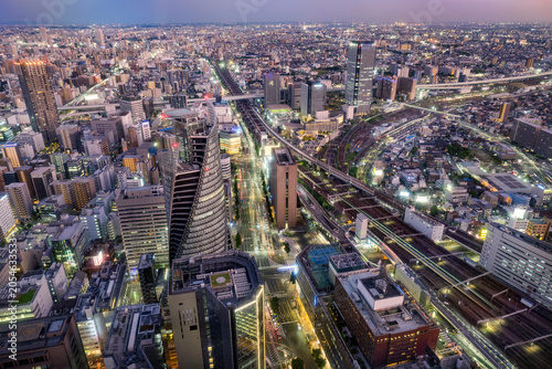 Принти на полотні Nagoya central business district skyline on the evening, modern skyscrapers, roads and railways under twilight sky
