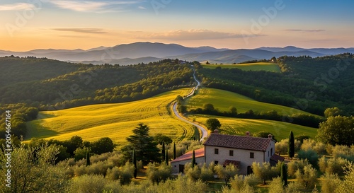 Golden hour sunset over rolling hills and countryside farmhouse