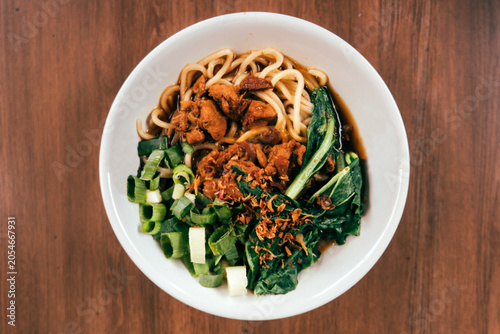 Indonesian Chicken Noodles with Green Onions and Leafy Vegetables