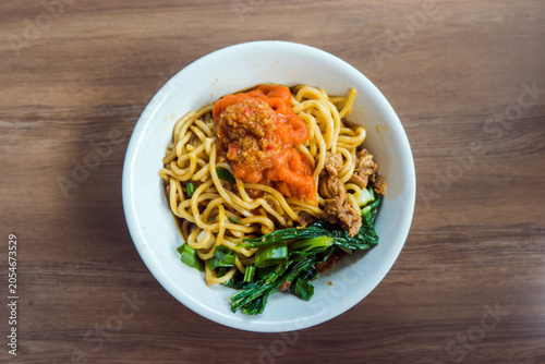Top View of Traditional Indonesian Mie Ayam With Red Chili Sauce