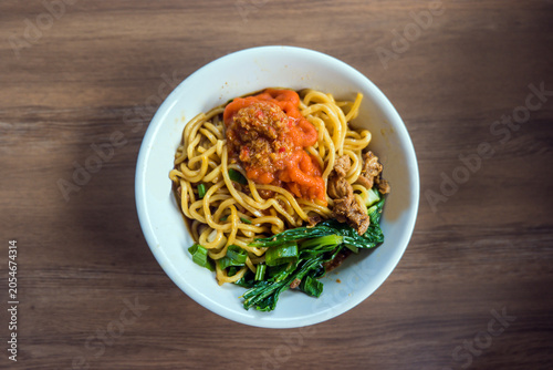 Top View of Indonesian Chicken Noodles on Wooden Table