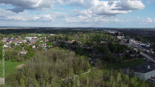 Aerial view of Milton, Ontario, Canada as shot from a drone on a mixed sunshine and clouds spring day in May, 2022. Flying south towards Main Street parallel to Bronte.