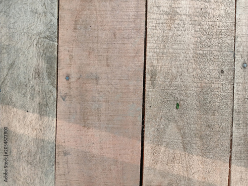 Top view of raw unpolished wooden planks texture background