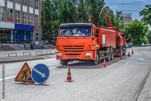 Temporary road signs at the repair site on a summer day