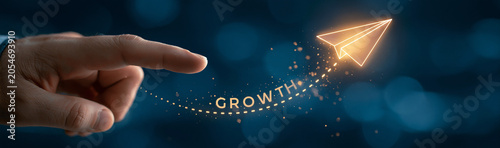 Propelling Growth: A finger directs a glowing paper airplane, inscribed with the word GROWTH, towards a brighter future, symbolizing ambition and forward momentum.