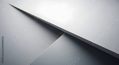 Two gray sheets intersect at an angle on a surface